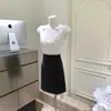 Falda Corta Versátil de Cintura Alta para Oficina Primavera Verano Color Sólido Algodón Tejido Directo de Fábrica con Etiquetas