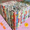 Rolo pequeno papel de embrulho aniversário fofo desenho animado festivo Natal papel revestido impressão presente presente papel colorido transfronteiriço venda quente