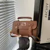 Bolso pequeño con textura retro para mujer 2026 primavera nuevo estilo moda japonesa coreana bolso de hombro único bolso de mano versátil bolso cruzado tipo almohada