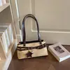 Bolsa de ombro de design de ponta transfronteiriça feminina nova tendência bolsa Boston retrô bolsa de mão de ombro único da moda para o dia a dia