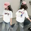 Nova Camiseta Estilosa de Manga Curta para Meninas Verão 2026, Blusa Fina da Moda para Crianças Maiores