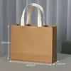 Bolsa de papel kraft empaque tienda de ropa para mujer bolso de mano regalo de maquillaje logo impreso personalizado franqueo de punto personalizado