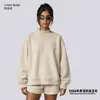 Conjunto de ropa europea y americana para mujer transfronterizo: sudadera casual y shorts, sudadera holgada de forro polar color liso, cuello medio alto, estilo 'dopamine hot girl'