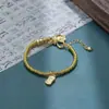 Nuevo Estilo Chino 2025 Retro Colgante de Fortuna Dios Amarillo de la Riqueza Pulsera de Arena Dorada con Cuentas Lujo Ligero Nicho Exquisita Pulsera para Mujeres Fábrica