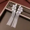 Pendientes de borla con colgante redondo de circón de aguja plateada, estilo vintage de lujo ligero y de alta gama, pendientes versátiles elegantes y modernos