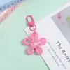 Novo Chaveiro de Flor Colorido Vazado Transparente Pingente de Joia DIY Versátil Criativo Charme para Bolsa Feminina