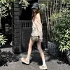 Camiseta a rayas de manga larga moderna y protectora del sol para mujer, atuendo de verano nuevo, puro y deseable, top holgado para cubrir en viajes