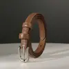 Nuevo cinturón de piel de vaca de capa superior para mujer con hebilla de pasador plateada, cinturón casual versátil de cuero genuino con un toque de alta gama para jeans