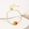 Estilo Europeo y Americano Minimalista Corona Roja Corazón Doble Agujero Ajustable Lujo Versátil Pulsera de Cobre Joyería