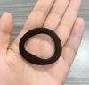 Envío Gratis Anillo de Cabello Sin Costuras Goma de Alta Elasticidad Tendón Cuerda para el Cabello para Mujer Estilo Coreano Cuerda para el Cabello Duradera