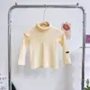 Camiseta básica para niña 2026 otoño e invierno nueva ropa para niños estilo coreano cuello alto capa interior color liso top térmico