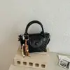 Bolsa de Tecido Nova da Moda para Primavera/Verão 2026 Bolsa de Mão Estilo Balde de Alta Qualidade Versátil Tendência Bolsa de Ombro Transversal