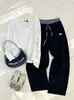 Camiseta base casual de cuello en V con dobladillo enrollado, nuevo top versátil casual de otoño de corte holgado de manga larga para mujer, directo de fábrica