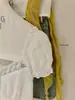 WGWE9507 Ropa de Mujer de las Trece Líneas de Guangzhou 2026 Nueva Blusa de Manga Corta con Adorno de Encaje para Ceñir la Cintura para Verano