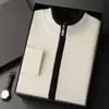 Suéter de cachemira grueso de lujo para hombre, chaqueta de punto casual de negocios con bloques de color y cárdigan de cuello alto