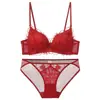 Nueva lencería sexy francesa de estilo europeo y americano, con un diseño transparente y seductor con espalda cruzada, encaje bordado y sujetador de copa triangular sin aros, creando un efecto push-up