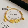 Joyería de Cobre Chapado en Oro Estilo Chino Nuevo con Monedas de los Cinco Emperadores y Pulsera de Calabaza Enrollada para Mujer, Lujo Ligero de Nicho con un Diseño de Alta Gama