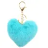 Venta caliente llavero de felpa de amor llavero de bola de pelo de corazón de melocotón colgante accesorios para equipaje de dama coche al por mayor