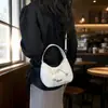 Bolso de mano de nicho de alta gama para mujer, nuevo modelo 2026, bolso de media luna con lazo de estrella, bolso cruzado simple