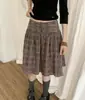 Falda abullonada plisada con estampado de cuadros teñido en hilo y textura plisada 100% algodón puro