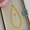 Collar de cuentas hecho a mano pequeño público blanco piedra natural calcedonia amarilla cadena de clavícula simple retro de verano para mujer