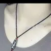Colgante de cuentas de nueve ojos de Xizang al por mayor colgante de ágata de cuentas de nueve ojos en blanco y negro accesorios para jugar con texto diy