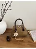 Bolsa Pequena Transfronteiriça Nova e Tendência para Mulheres, Bolsa de Designer de Nicho, Bolsa de Ombro e Transversal Estilosa de Alto Valor