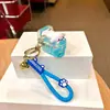 Chaveiro de copo de chá de leite com bolhas brilhantes de óleo pingente fofo de areia movediça líquida acessórios para mochila pequenos presentes atacado