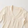 Ins moda feminina atacado estilo europeu e americano cruzado garota popular petite gola V ombro direito retalhos manga curta média slim fit camiseta