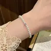 Pulsera de perlas sintéticas extremadamente simple para mujer, nuevo estilo 2026, pulsera elástica, de nicho y exquisita, perfecta como regalo para amigas cercanas
