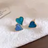 Pendientes de botón asimétricos con forma de corazón de gota de aceite de aguja plateada, pendientes de moda de temperamento exquisito de nicho, joyería para orejas versátil de sentido de lujo ligero de alta gama