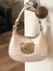 Bolso de cuadros de nicho exquisito y moderno para mujer, nuevo modelo 2026, minibolso cruzado versátil, bolso tipo dumpling, bolso de mano pequeño para salir