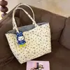 Bolsa Tote de Lona Grande Capacidade Coração com Laço 2026 Nova Feminina Versátil Ombro Único Moda Portátil para o Dia a Dia