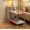 Mesita de noche moderna y minimalista para uso doméstico, adecuada para dormitorios y apartamentos de alquiler; una mesa auxiliar o mesa de centro simple y pequeña que se puede colocar al lado de un sofá