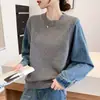 Nuevo jersey de cuello redondo con detalles de manga de mezclilla, moda de otoño e invierno, corte holgado, suéter de punto con un estilo casual y relajado
