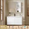 Tocador de baño engrosado y ahorrador de espacio con diseño en color crema, que cuenta con un lavabo redondeado, lavabo cerámico integrado y un lavabo de una sola pieza.