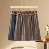 Saia de couro de alta qualidade, cintura alta da moda, saia evasê que afina a silhueta, saia curta justa ao corpo, saia midi, nova coleção de outono 2026 feminina, cintura alta
