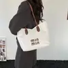 Bolso de hombro versátil de gran capacidad transfronterizo 2026 nueva tendencia de moda color sólido patrón personalizado bolso tote bolso cruzado