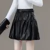 Falda corta abullonada para mujer, nuevo estilo otoño/invierno 2026, de cintura alta, adelgazante, falda acampanada plisada, anti-exposición, minifalda de capullo floral