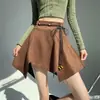 Falda retro de ante para mujer, nuevo estilo otoño e invierno, minifalda de cintura alta con dobladillo irregular, falda de paraguas