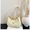 Bolso de Hombro tipo Hojalata 2026 con Lazo, Sensación de Lujo, Diseño de Nicho, Versátil para el Trabajo, Bolso de Media Luna de Gran Capacidad