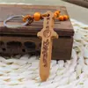 Serie de Artefactos Taoístas Personalizados Hacha de Madera de Durazno Espada de Madera de Durazno Llavero de Madera de Durazno Run Jianghu Artesanía Caliente de Madera de Durazno