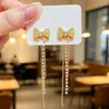 Pendientes Colgantes Largos de Cuadros Estilo Coreano Lujo Ligero Llevado de Dos Maneras Tendencia INS Lujo Ligero Nicho Pendientes con Borla de Pedrería