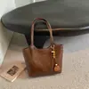 Nova bolsa tote de outono 2026, bolsa de grande capacidade para mulheres, adequada para estudantes universitários, trabalho e deslocamento, bolsa de ombro estilosa