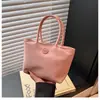Bolsa de tela nueva transfronteriza color macarrón bolso de mano ligero versátil elegante bolso cubo nicho bolsa de transporte exterior para mujer