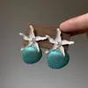 Pendientes de Estrella de Mar y Concha Estilo Vacaciones de Primavera y Verano 2026 Nueva Moda Diseño de Nicho de Alta Gama Pendientes Únicos