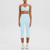 Conjunto deportivo de yoga con sujetador de yoga sin costuras de nuevo estilo transfronterizo con relleno incorporado, alta elasticidad, secado rápido y pantalones capri para correr