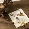 2026 Collar Retro de Cuerda Tejida a Mano con Cuentas de Acero de Titanio para Mujer Diseño de Nicho Estilo Étnico Cadena para Suéter Accesorios de Flor