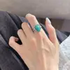 Anillo de jade gota de agua atmósfera fresca y elegante nuevo estilo para mujer borde martillado abierto ajustable nicho joyería de mano de alta gama mujer