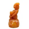 Ventas directas de fábrica imitación piedra Shoushan exquisita antigua antigua talla en piedra pierna de belleza sosteniendo columpio pequeño tallado adornos de piedra raros